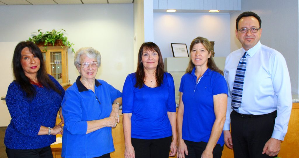 front office view of Dr. Sam & chiropractic care staff